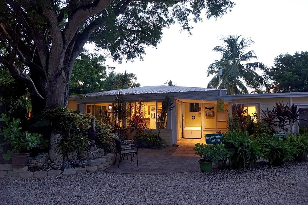 Welcome area and lobby building at Bay Harbor & Coconut Bay Resort during dusk